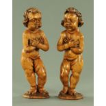 A pair of Indo-Portuguese carved softwood figures of putti, 18th/19th century,
