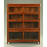 An oak sectional bookcase, in the style of Globe Wernicke, four sections,