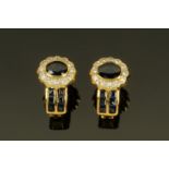 A pair of 18 ct gold sapphire and diamond cluster earrings.