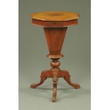 A Victorian walnut trumpet form sewing table,