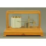 An oak cased Sewills of Liverpool barograph, with glass case and chart drawer to base.