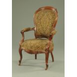 A Victorian mahogany armchair, with exposed moulded showframe, upholstered back,