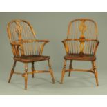 A pair of comb back Windsor armchairs,