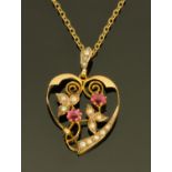A 9 ct gold heart shaped pendant set with seed pearls and ruby coloured stones,