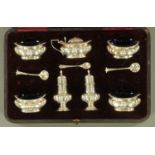 A cased silver condiment set, Birmingham 1897 (see illustration).