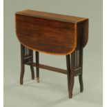 An Edwardian inlaid mahogany Sutherland table, raised on tapered legs of square section.