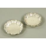 A pair of French silver dishes, with shaped sides and threaded rims,