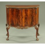 A flame veneered mahogany commode cabinet,