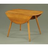 An Ercol light elm drop leaf dining table, circa 1960/70's, supported on four tapering square legs.