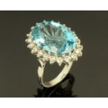 An 18 ct white gold blue topaz cluster ring, topaz +/- 29.71 carats, size M/N.