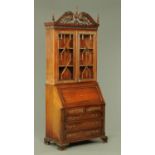 A reproduction 18th century style mahogany bureau bookcase,