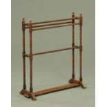 A Victorian towel rail, with turned supports. Width 73 cm.