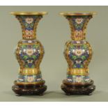 A pair of cloisonne vases, early 20th century, each with flared lip and metal ribs,