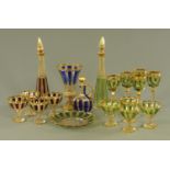 A collection of Bohemian glassware, ruby, blue and green flash with gilding. Decanter height 37.