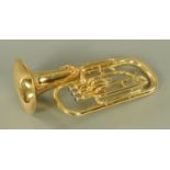 A brass euphonium engraved for C Giant, +/- 56 cm long with mouthpiece,