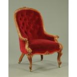 A Victorian mahogany framed button back armchair,