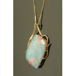 A large doublet opal pendant, in 14 ct gold mount stamped "585", on 9 ct gold fine link chain.