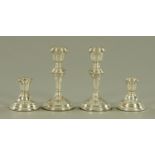 Two pairs of candlesticks, Birmingham 94, all loaded. Tallest 14 cm.