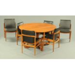 A teak drop leaf dining table with 6 chairs,