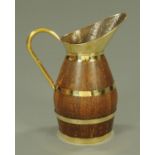 A large oak and brass mounted coopered jug, 19th century,