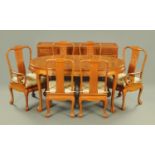 A Chinese rosewood dining room suite, each piece decorated with relief carved flowers,