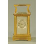 An early 20th century French carriage clock, with silvered dial and Roman numerals,