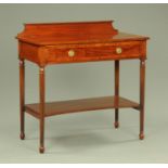 An Edwardian mahogany serving table by Maple & Co,