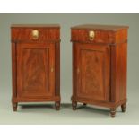 A pair of Regency style mahogany pedestal cabinets,