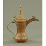A Turkish copper and brass dallah coffee pot, 19th century, with brass finial, handle and hinge,