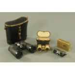 A cased pair of Lieberman & Gortz binoculars, a cased set of German mother of pearl opera glasses,