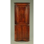 A George III mahogany standing corner cupboard,