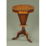 A Victorian parquetry topped games worktable,