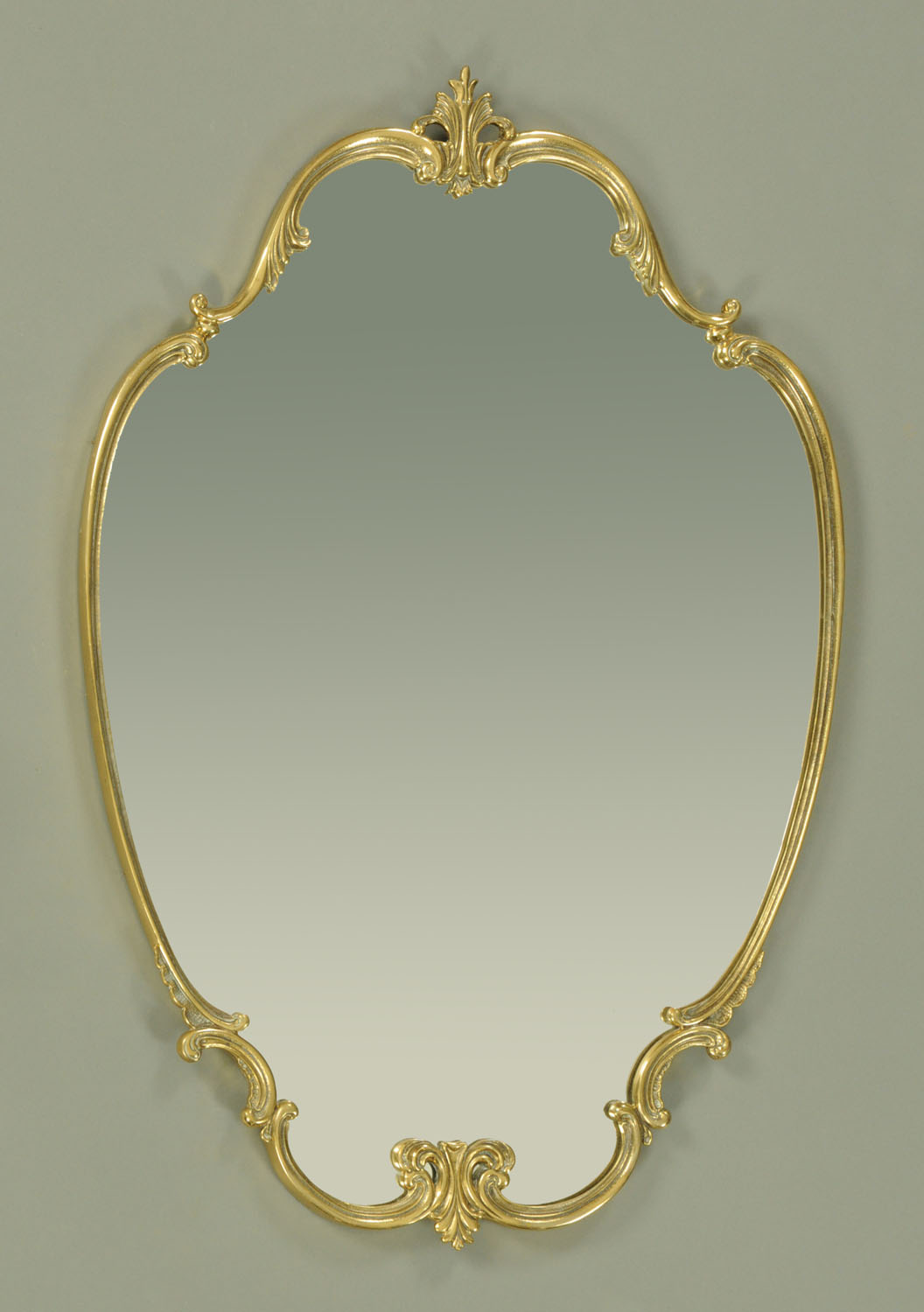 A brass framed mirror. 64 cm x 94 cm.