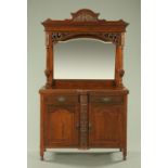 A late Victorian walnut mirror back sideboard, fitted with drawers and cupboards. Width 121 cm.