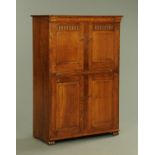 An oak Arts & Crafts style cupboard with slide,