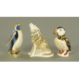 Three Royal Crown Derby paperweights, Emperor Penguin, wolf and puffin,