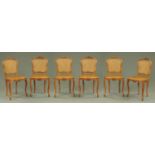 A set of six French walnut bergere dining chairs,