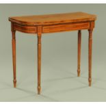 A late George III crossbanded mahogany card table, with satinwood and ebony stringing,