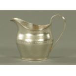 A George III silver cream jug, Duncan Urquhart and Naphtali Hart, London 1803,