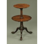 A George III mahogany two tier circular dumbwaiter,