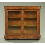 A Victorian walnut veneered vitrine,