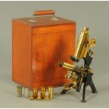 A W Watson & Sons lacquered brass monocular microscope, early 20th century, on japanned stand,