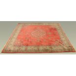 A large deep pile Persian design rug,