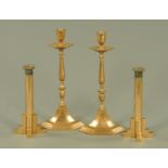 A pair of early 20th century Classical style copper candlesticks,