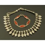 An ethnic style silver coloured metal necklace,