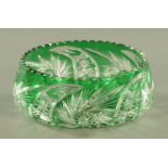 A Bohemian green on clear overlay glass fruit bowl, 20th century,