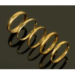 Five 9 ct gold wedding bands, three 22 ct, 5.8 grams and two 18 ct, 2.7 grams.