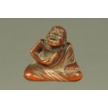 A small Japanese carved hardwood Netsuke,