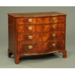 An early 19th century mahogany serpentine fronted chest of drawers,