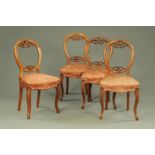 A set of four Victorian walnut balloon back dining chairs,